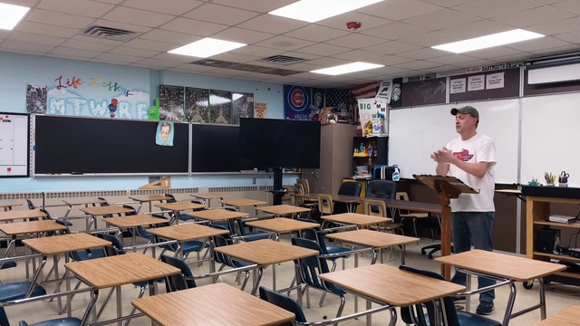 Video Reference: Table, Furniture, Building, Chair, Interior design, Academic institution, Event, Class, Hall, Education