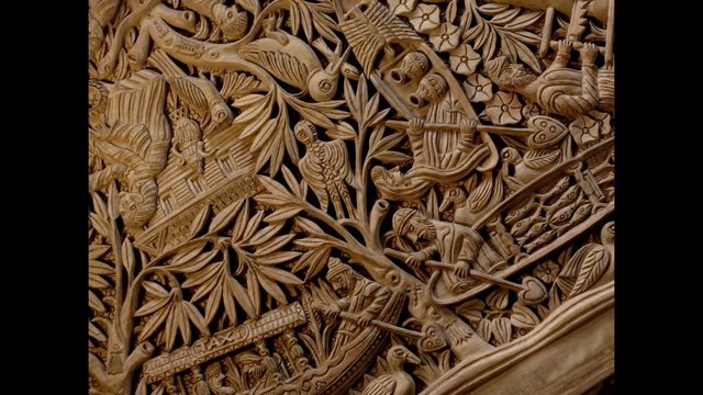 Video Reference: wood carving, relief, ornamental, birds, leaves, folk art, handcrafted, pattern, texture, decorative, sculpture, carved wood, artisan, nature motif