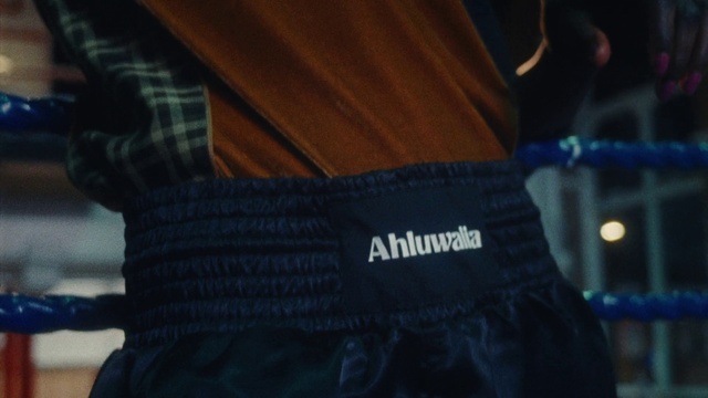 Video Reference: Sleeve, Sportswear, Elbow, Electric blue, Wrist, Human leg, Font, Denim, Waist, T-shirt