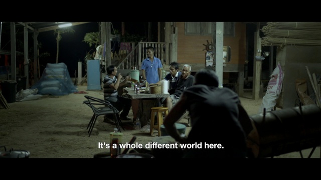 Video Reference: Screenshot, Table, Event, Darkness, Desk, Sitting, Building, Room, Chair, Font