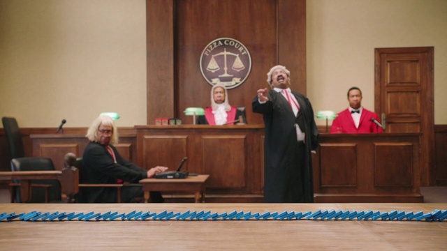 Video Reference: Outerwear, Microphone, Vertebrate, Coat, Chair, Spokesperson, Suit, Flag, Community, Hearing