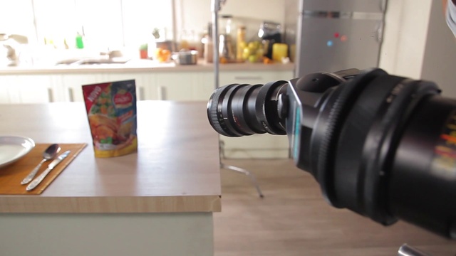 Video Reference: Table, Camera lens, Wood, Digital camera, Reflex camera, Cameras & optics, Flooring, Floor, Camera accessory, Hardwood