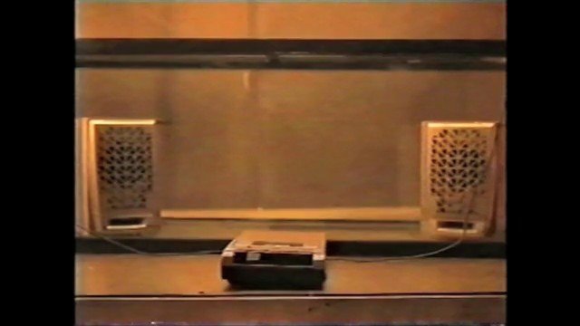 Video Reference: indoor, wall, vents, speakers, device, floor, room, symmetrical, low_resolution, interior, plain_background