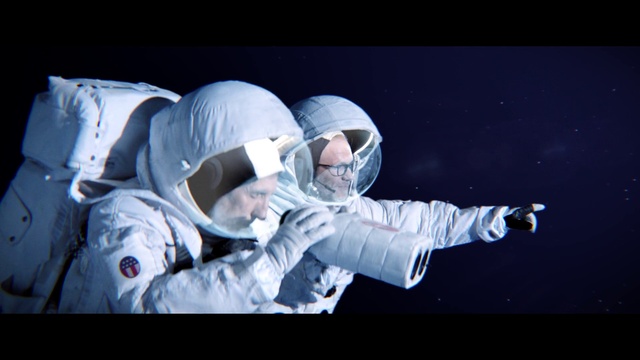 Video Reference: Helmet, Sleeve, Gesture, Sports gear, Font, Performing arts, Entertainment, Personal protective equipment, Event, Astronaut