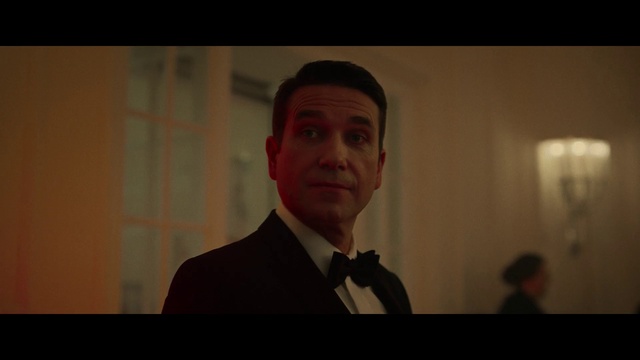 Video Reference: Forehead, Flash photography, Dress shirt, Microphone, Formal wear, Event, Facial hair, White-collar worker, Tie, Official