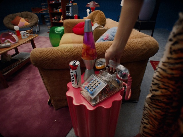 Video Reference: Table, Furniture, Bottle, Alcoholic beverage, Couch, Drink, Thigh, Fun, Flooring, Wood