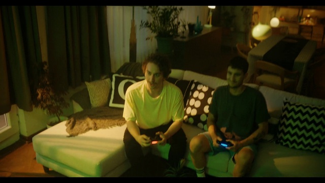 Video Reference: Comfort, Green, Shorts, Leisure, Curtain, Plant, Event, T-shirt, Couch, Recreation