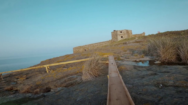 Video Reference: Sky, Ecoregion, Building, Landscape, Horizon, Slope, Plant, Shore, Wood, Road