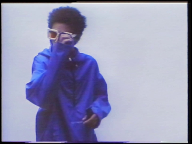 Video Reference: Vision care, Sleeve, Goggles, Gesture, Eyewear, Headgear, Sunglasses, Electric blue, Rectangle, Magenta