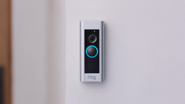 Video Reference: doorbell, video doorbell, smart home, security camera, home security, wall mounted, close-up, indoor, technology, entrance, doorway, silver, black, blue light, device, residential