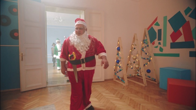 Video Reference: Smile, Flooring, Event, Art, Santa claus, Hat, Fashion design, Fictional character, Costume, Fun
