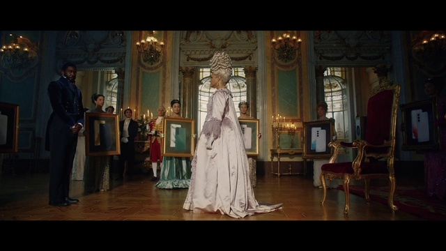 Video Reference: Window, Dress, Chair, Gown, Entertainment, Fashion design, Wedding dress, Performing arts, Formal wear, Suit