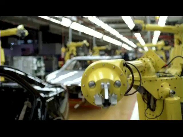 Video Reference: factory, robotic arm, automation, manufacturing, industrial, workshop, car body, assembly line, machinery, engineering, vehicle production, interior, production