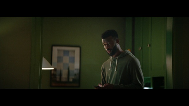 Video Reference: Flash photography, Font, Audio equipment, Event, Facial hair, Darkness, T-shirt, Midnight, Display device, Eyewear