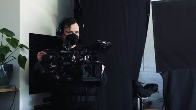 Video Reference: Videographer, Video camera, Camera, Cameras & optics, Cinematographer, Television crew, Film crew, Plant, Filmmaking, Flash photography