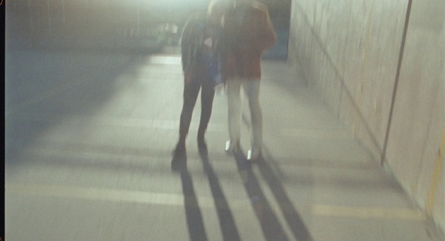 Video Reference: Gesture, Wood, Floor, Flooring, Tints and shades, Road surface, Thigh, Human leg, Sidewalk, Road