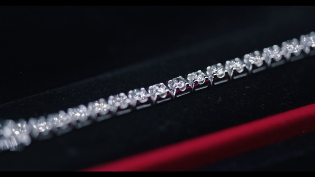 Video Reference: Automotive design, Font, Jewellery, Electric blue, Magenta, Metal, Fashion accessory, Macro photography, Luxury vehicle, Titanium