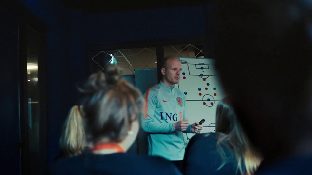 Video Reference: T-shirt, Event, Fun, Space, Entertainment, Conversation, Recreation, Display device, Darkness, Room