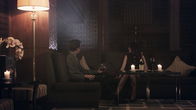 Video Reference: Black, Interior design, Lamp, Suit, Comfort, Tints and shades, Event, Darkness, Candle, Coffee table