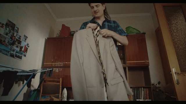 Video Reference: Sleeve, Fashion design, Event, Formal wear, Vintage clothing, Room, Art, Drama, Entertainment, Chair