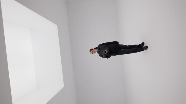 Video Reference: Grey, Sleeve, Plaster, Ceiling, Collar, Walking shoe, Blazer, Elbow, Outdoor shoe, Room