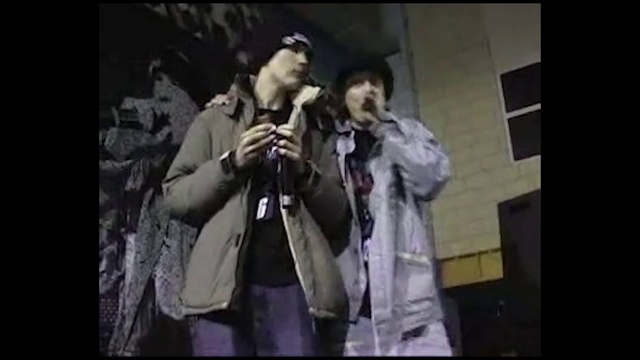 Video Reference: Flash photography, Gesture, Microphone, Event, Music artist, Entertainment, Fun, Beard, Formal wear, Eyewear