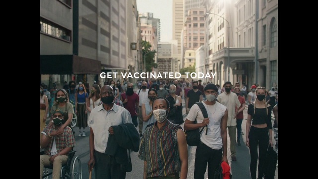 Video Reference: Building, Shorts, Public space, Crowd, City, Road, T-shirt, Urban area, Event, Human settlement