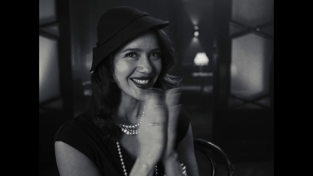 Video Reference: Smile, Lip, Eye, Eyebrow, Black, Flash photography, Cap, Black-and-white, Style, Eyewear