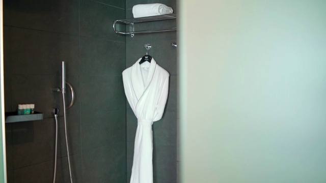 Video Reference: Outerwear, Clothes hanger, Sleeve, Grey, Jewellery, Fashion design, Curtain, Fashion accessory, Knot, Electric blue