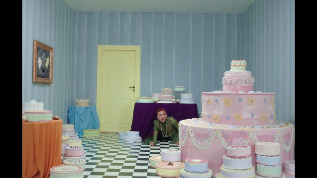 Video Reference: Food, Furniture, Table, Cake decorating, Textile, Decoration, Purple, Interior design, Cake decorating supply, Curtain