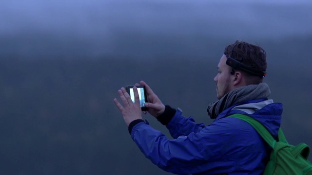 Video Reference: Outerwear, Gesture, Jacket, Baseball cap, Cap, Recreation, Sky, Landscape, Windbreaker, Electric blue