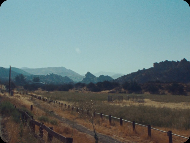 Video Reference: Sky, Plant, Nature, Mountain, Natural landscape, Land lot, Fence, Biome, Tree, Landscape