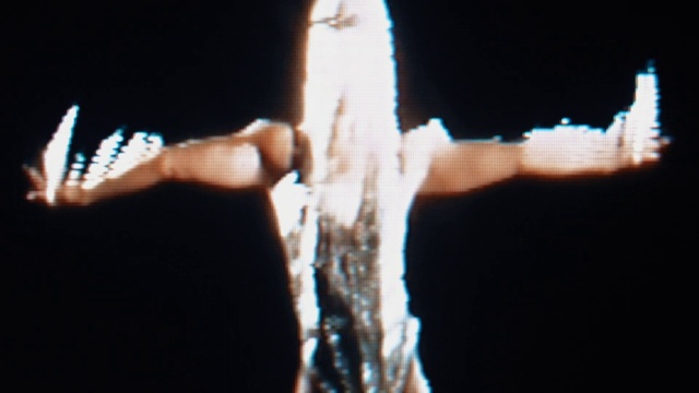 Video Reference: Hand, Gesture, Finger, Thumb, Font, Event, Wrist, Electric blue, Flash photography, Darkness