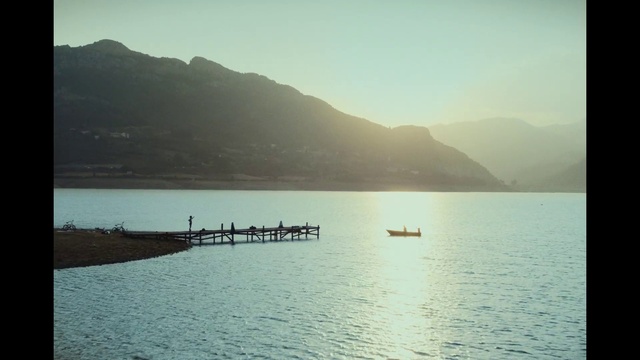 Video Reference: Water, Sky, Water resources, Boat, Mountain, Lake, Watercraft, Horizon, Atmospheric phenomenon, Rectangle