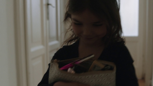 Video Reference: Nose, Lip, Hairstyle, Office supplies, Happy, Audio equipment, Long hair, Writing, Fun, Sitting