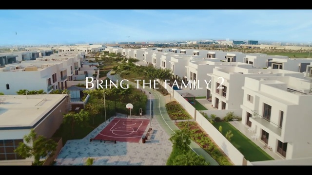 Video Reference: Sky, Daytime, Plant, Building, Cloud, Land lot, Urban design, Window, Neighbourhood, Landscape