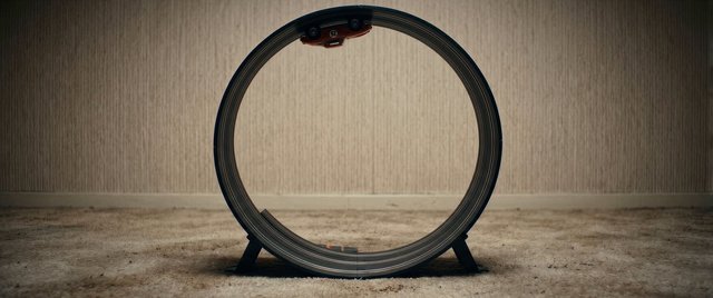 Video Reference: toy car, race track, loop, circular track, indoor, car toy, minimal scene, carpet, room, engineering, playroom, centered, symmetry, macro, still life