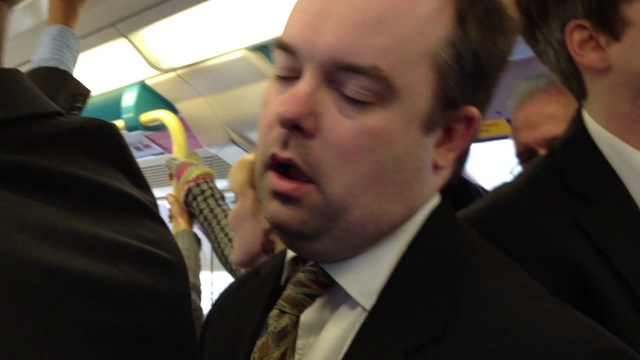 Video Reference: Coat, Gesture, Suit, Tie, Blazer, White-collar worker, Event, Formal wear, Fun, Dress shirt