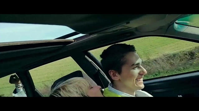 Video Reference: Hair, Smile, Vehicle, Motor vehicle, Sky, Cloud, Car, Window, Automotive mirror, Automotive design