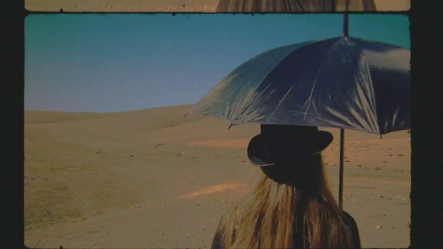 Video Reference: Umbrella, Sky, Shade, Travel, Landscape, Tints and shades, Erg, Singing sand, Aeolian landform, Wind