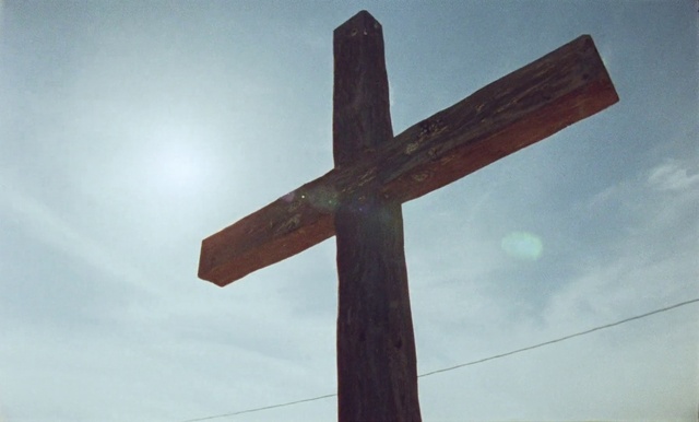 Video Reference: Cloud, Sky, Cross, Wood, Crucifix, Religious item, Symbol, Symmetry, Tree, Font