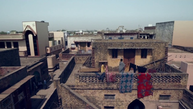 Video Reference: Sky, Window, Urban design, Residential area, House, Facade, Landscape, Building, Roof, City