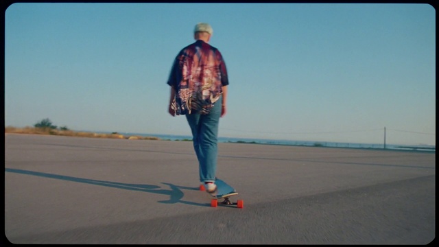 Video Reference: Footwear, Sky, Azure, Asphalt, Street fashion, Travel, Rolling, Road surface, Denim, Tree