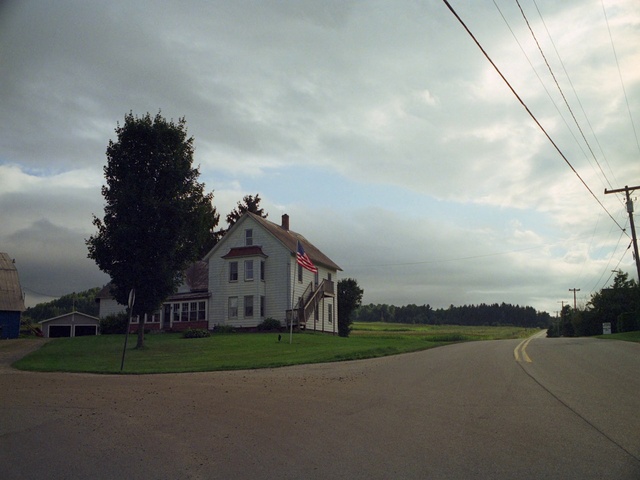 Video Reference: Cloud, Sky, Plant, Building, Window, House, Land lot, Tree, Road surface, Atmospheric phenomenon
