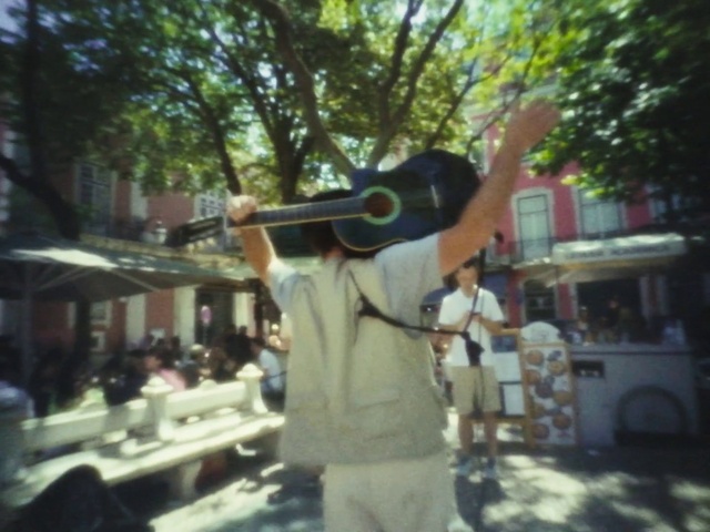 Video Reference: Tree, Hat, Shorts, Travel, Leisure, Wind instrument, Fun, Event, T-shirt, Recreation