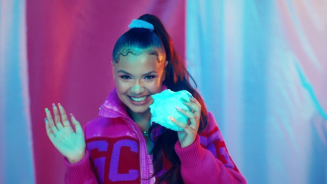 Video Reference: Smile, Purple, Textile, Gesture, Entertainment, Pink, Happy, Performing arts, Magenta, Fun