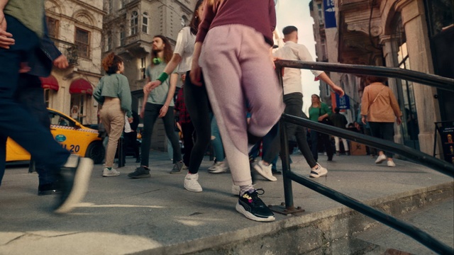 Video Reference: Footwear, Jeans, Trousers, Shorts, Leg, Entertainment, Thigh, Public space, Performing arts, Leisure