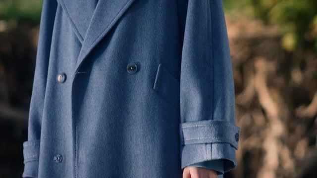 Video Reference: Outerwear, Overcoat, Dress shirt, Dress, Textile, Neck, Sleeve, Coat, Grey, Collar