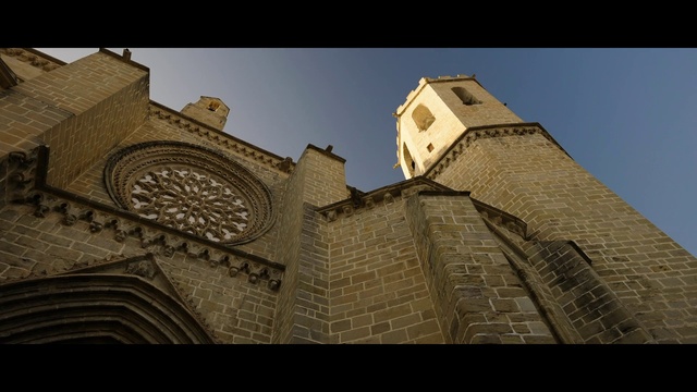 Video Reference: Sky, Building, Window, Tower, Brick, Tints and shades, Facade, Art, City, Symmetry