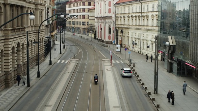 Video Reference: Car, Building, Vehicle, Window, Infrastructure, Thoroughfare, Road surface, Mode of transport, Line, Urban design